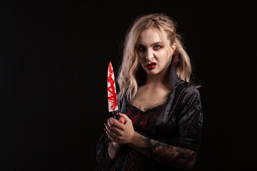 Portrait of beautiful and seductive boody vampire woman for hallooween. Gorgeous vampire goddess.