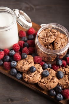 Healthy vegan oatmeal chocolate chip cookies with dark chocolate. Fresh bluebarries.