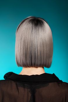 Beautiful young woman with fashion style haricut in studio. Woman with short hair.