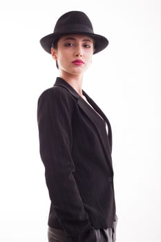 Caucasian beauty posing in studio posing wiht confidence in front of the camera over white background. Fashionable young female.
