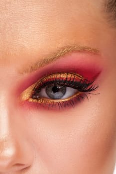 Close up of beautiful girl with fresh pink and golden makeup. Fashion makeup. Beautiful caucasian woman.