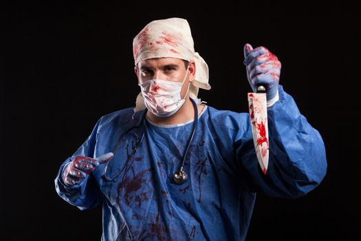 Young man with bizzare face having a mental disorder for halloween. Doctor looking like a man with serious mental illness.