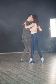 Attractive young woman dacing kizomba with her boyfriend. Beautiful performance.