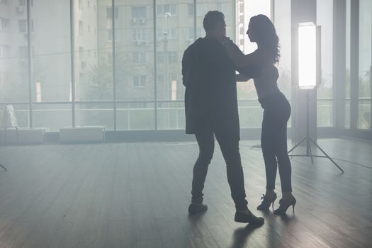Young couple dancing kizomba with beautiful style and grace. Beautiful performance.Skillful dancers.