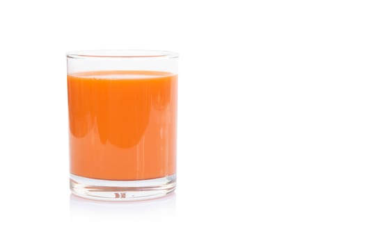 Closeup glass of fresh carrot juice isolated on white background, healthy diet food drink