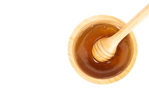 Top view honey in wood bowl with honey dripper isolated on white background, Skin care and spa beauty concept