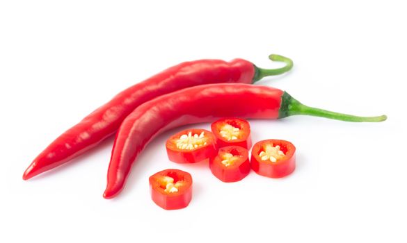 Closeup red chili pepper with sliced on white background, raw food ingredient concept