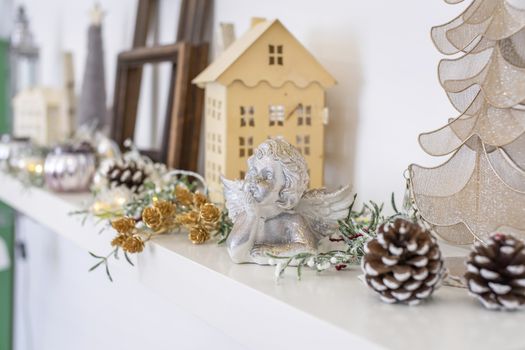 Neutral wooden Christmas holiday home decoration on a shelf, still life.