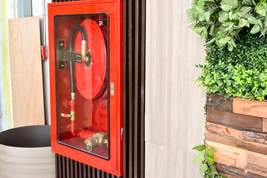 A fire extinguisher is installed in the glass cabinet.