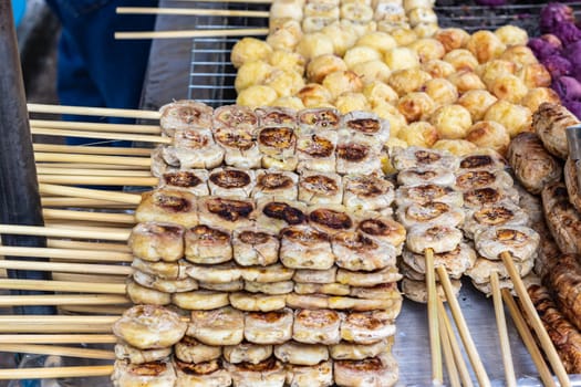 Grilled sweet bananas on street food stall in Thailand