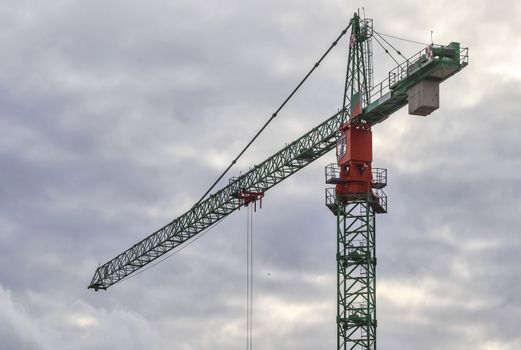 Several cranes on constructions sites at high buildings all over Europe.