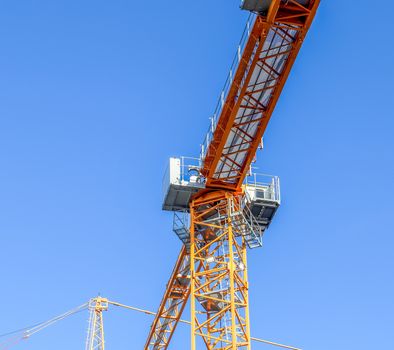 Several cranes on constructions sites at high buildings all over Europe.