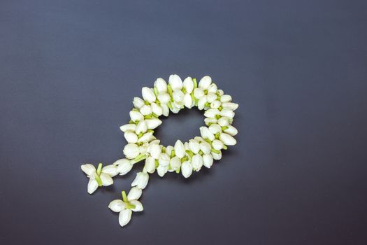 Thai traditional jasmine garland on black wooden table