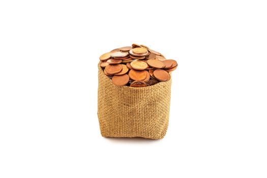 coins spilled from brown bag isolated on white background