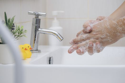 Personal hygiene, cleansing the hands. Washing hands rubbing with soap man for corona virus prevention, hygiene to stop spreading coronavirus.