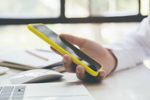 Young man using mobile phone. Using online connect technology for business, education and communication. 