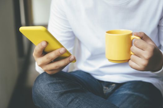 Young man using mobile phone. Using online connect technology for business, education and communication. 