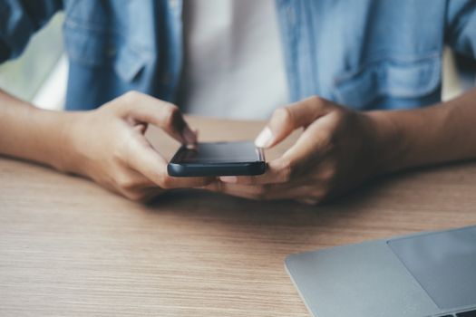 Young man using mobile phone. Using online connect technology for business, education and communication. 