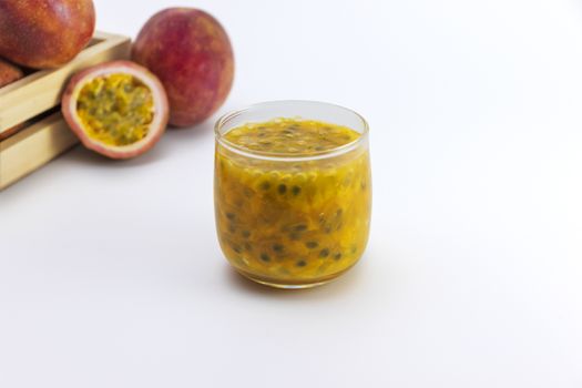 passion fruit juice in a glass on white background