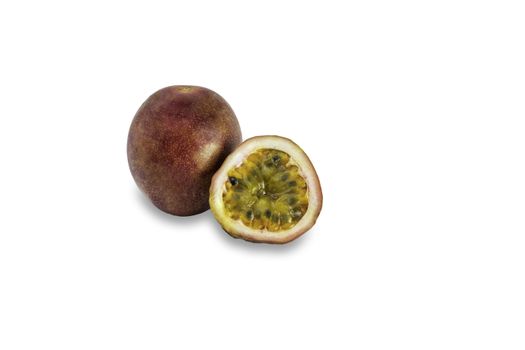 Whole passionfruit and a half of maracuya isolated on white background. 