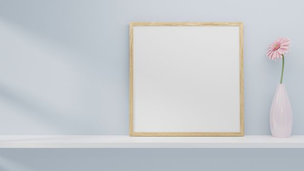 A blank picture and poster frame set on a shelf on the wall. 3D rendering