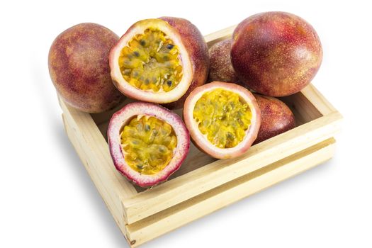 Passion Fruits tropical asian fruits and diet food in wooden box isolated on white background