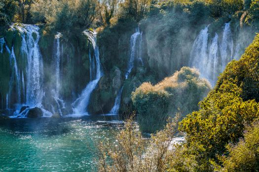 Kravice waterfall in Bosnia and Herzegovina, jets of water falling from a height of twenty-five meters among greenery