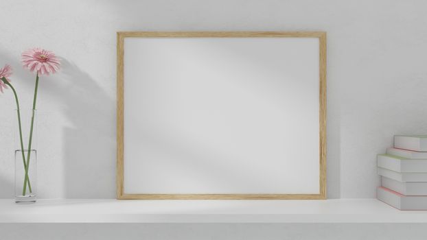 A blank picture and poster frame set on a shelf on the wall. 3D rendering.