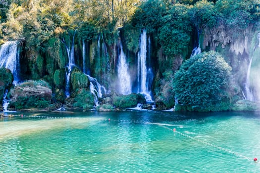 Kravice waterfall in Bosnia and Herzegovina, jets of water falling from a height of twenty-five meters among greenery