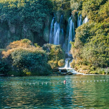 Kravice waterfall in Bosnia and Herzegovina, jets of water falling from a height of twenty-five meters among greenery