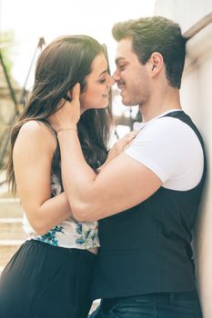 Couple love feeling. Loving harmony. First kiss. A young man and a young woman. The relationship between men and women. The woman has nice smile and approaches to kiss him.