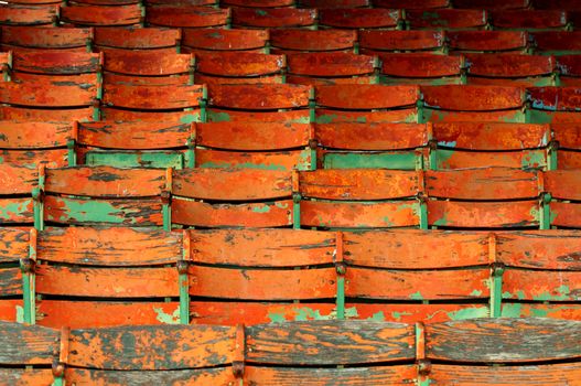 Old orange and green painted seats.