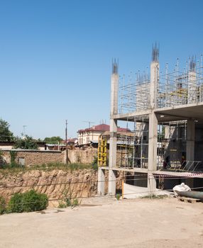 metal concrete structures of the building under construction. scaffolding and supports