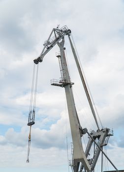 cargo port crane against the sky, isolated