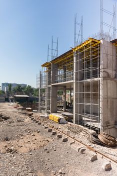 metal concrete structures of the building under construction. scaffolding and supports.