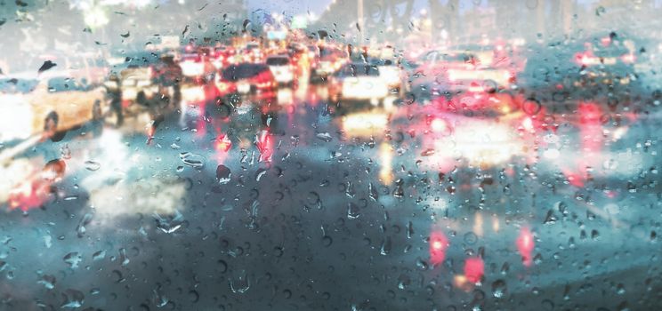 Raindrop on car mirror in rainy season rain background