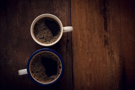 Cup of coffee on wooden background. Copy space. Top view. Flat lay