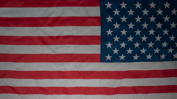 Abstract american flag on concrete cement wall, USA flag background with copy space. Top view