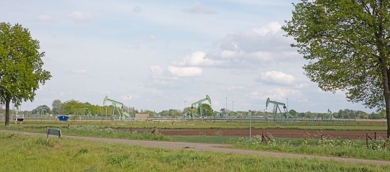 Landscape with oil pump jack, west germany