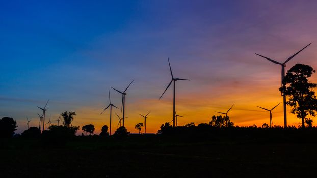 Wind turbines during beautiful sunset,silhouette