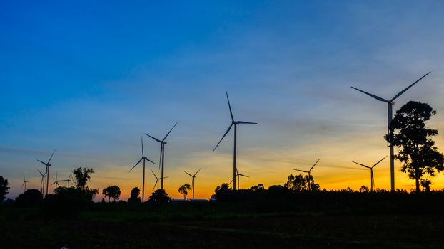 Wind turbines during beautiful sunset,silhouette