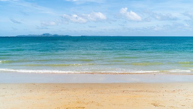 Background of Sea, Sand, and Blue Sky