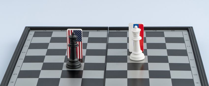 Symbols flag of Russia and the United States on the chessboard. The concept of political game.