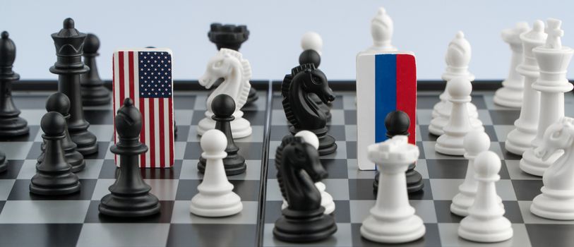 Symbols flag of Russia and the United States on the chessboard. The concept of political game.