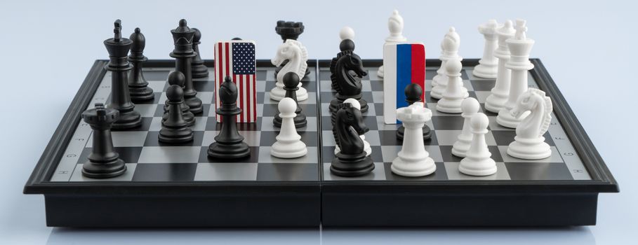 Symbols flag of Russia and the United States on the chessboard. The concept of political game.