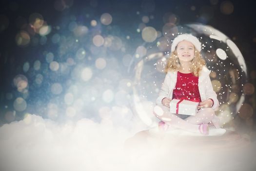 Festive child in snow globe against dark abstract light spot design