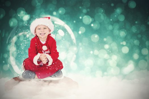 Festive child in snow globe against blue abstract light spot design