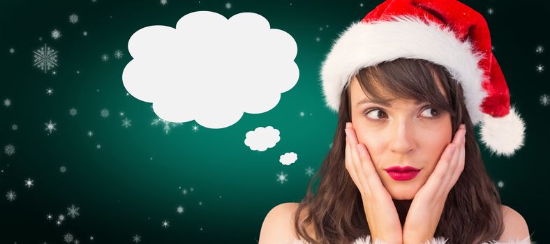 Pretty santa girl with hands on face against green background with vignette