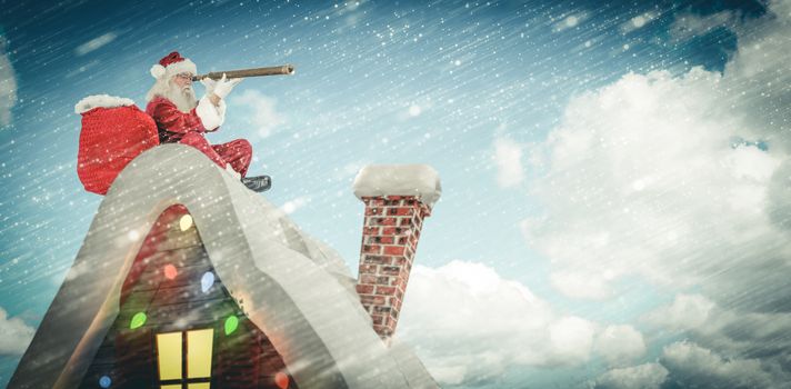 Santa sitting on roof of cottage against scenic view of blue sky