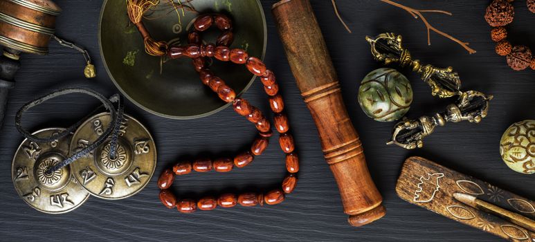 Copper singing bowl, prayer beads, prayer drum, stone balls and other Tibetan religious objects